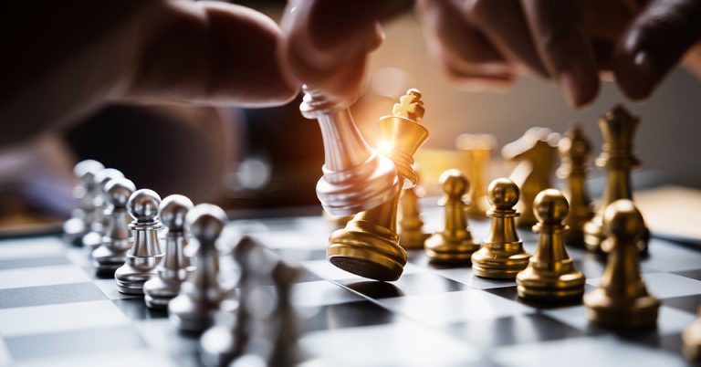 businessman playing or moving chess figure in competition success play. strategy, leadership concept